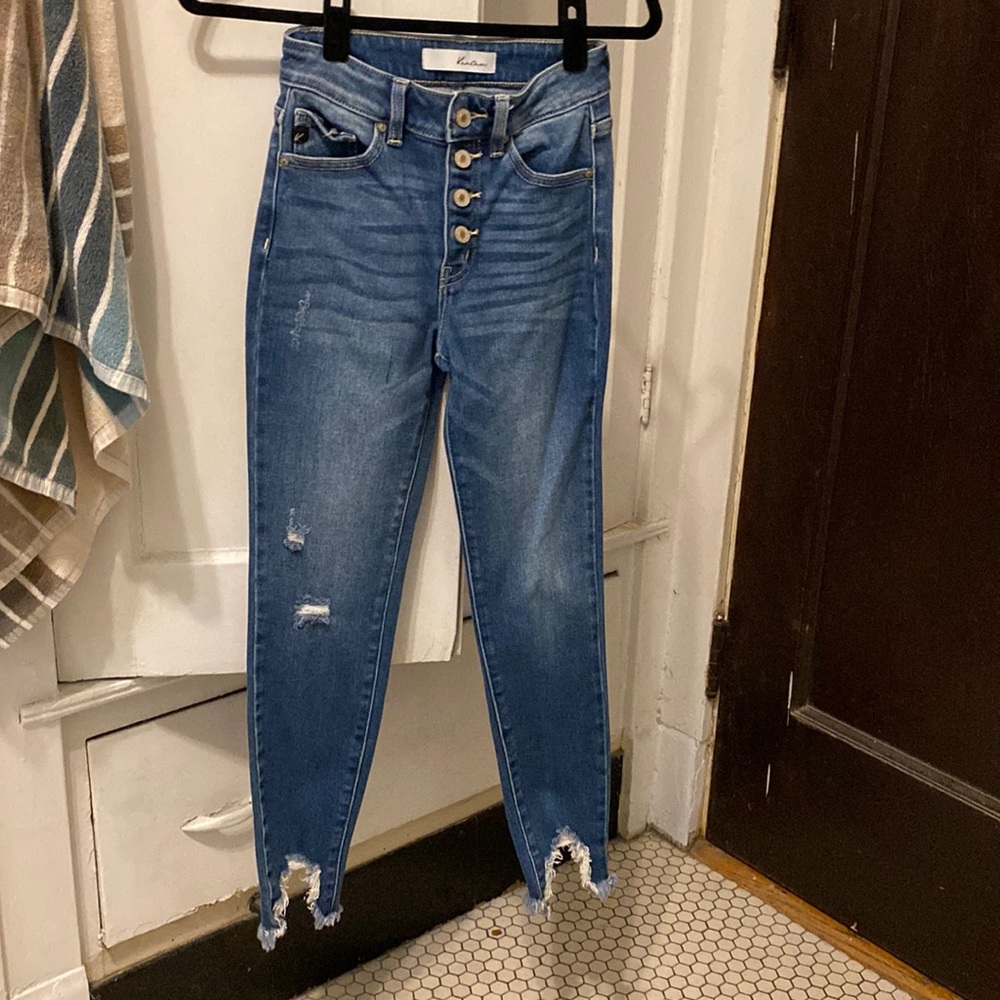 High rise skinny jeans with chic distressed hem. Looks great with booties.